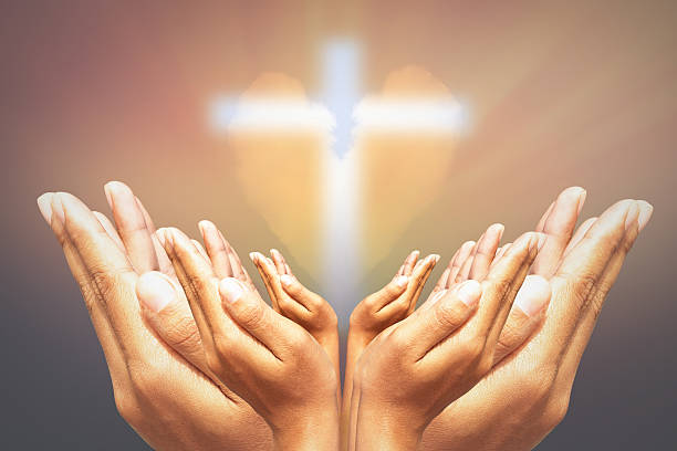 istock Hands, bless the cross in the sky. 522370476