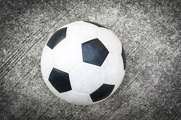 istock soccer ball on the cement floor 522370528