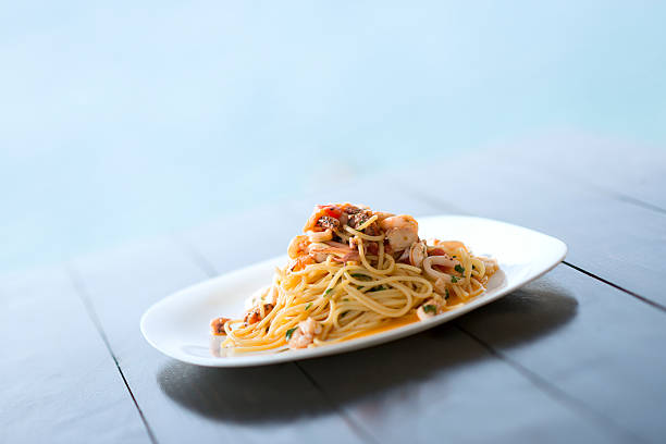 istock Spaghetti with Mixed Raw Seafood Plate by the Sea 522370676