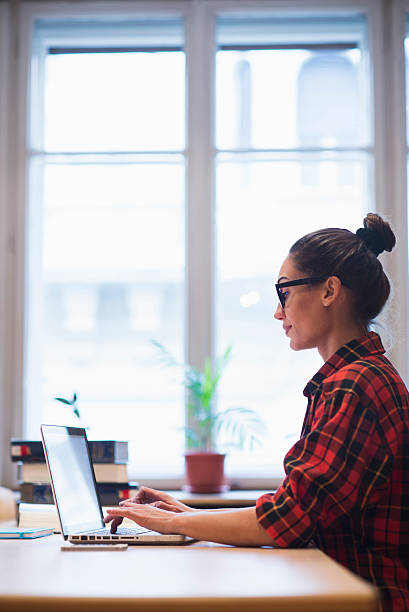 istock Young woman working in office 522371050