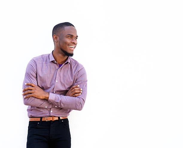 istock Young african guy looking away and smiling 522371402