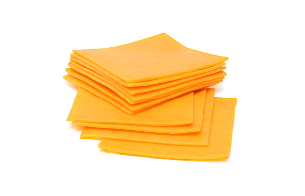 istock cheese slices isolated on the white background 522372710