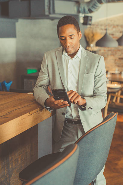 istock Young businessman typing on the smart phone 522372920