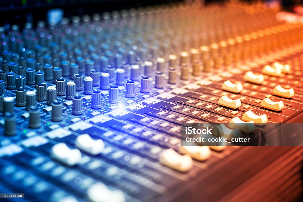 An Audio mixing table in soft light An Audio mixing table in soft light . Audio Equipment Stock Photo