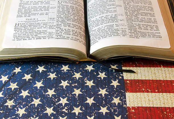 istock Holy Bible against an American Flag 522374476