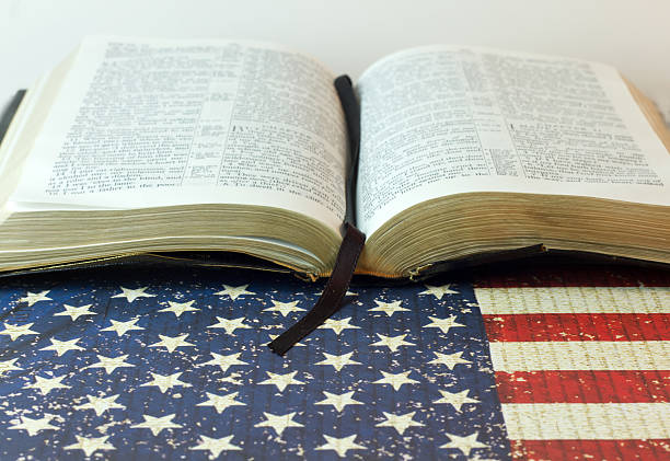 istock Holy Bible against an American Flag 522374500