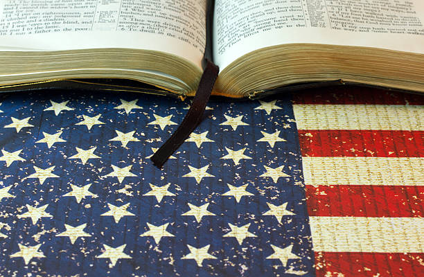 istock An Opened Bible on an American Flag Background 522374540