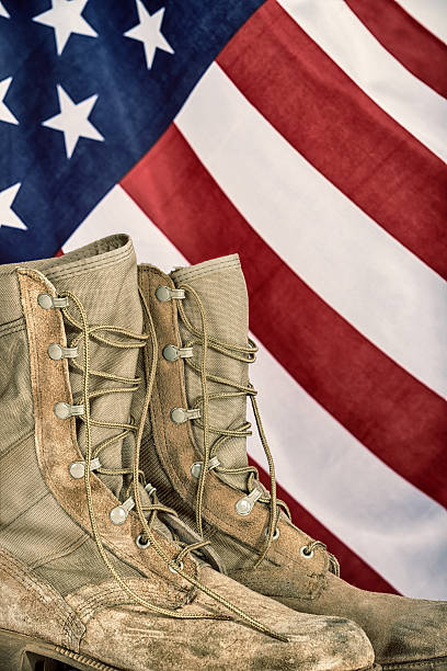 istock Old combat boots with American flag 522374744