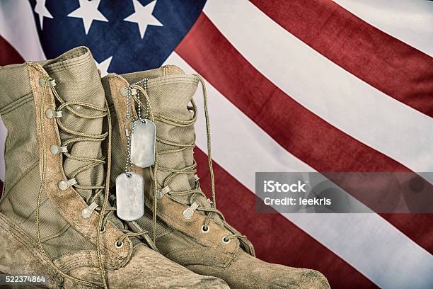 Old Combat Boots And Dog Tags With American Flag Stock Photo - Download Image Now - Dog Tag, Boot, Military