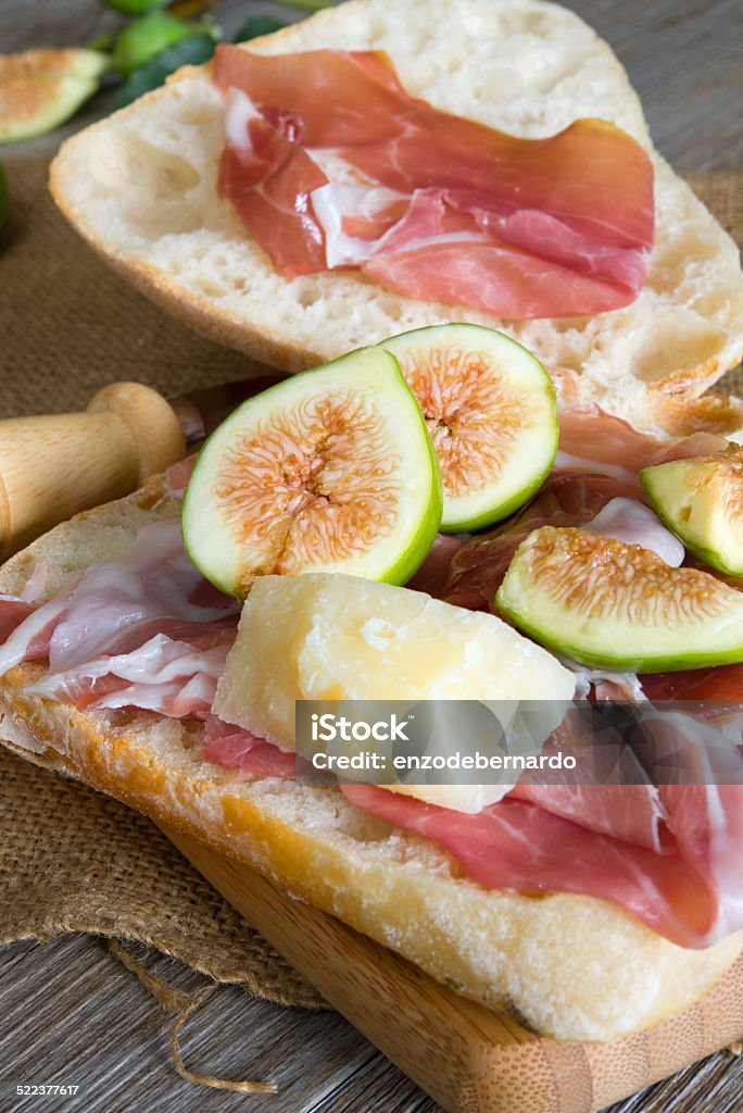 figs bread and ham appetizer cutting board with homemade bread parma ham and figs Bread Stock Photo