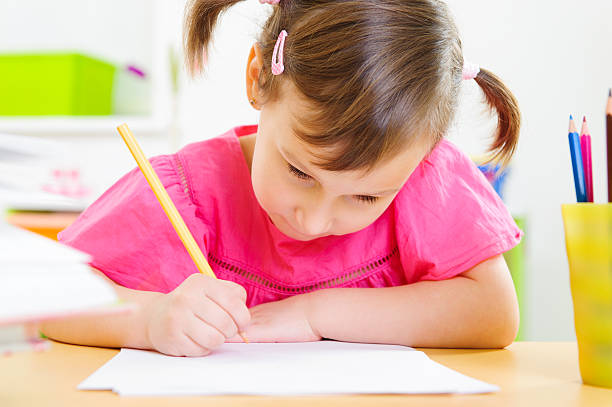 istock Cute little girl study at home 522378203