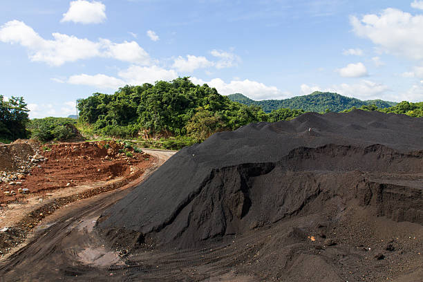 Coal Stock pile and blue sky Coal Stock pile. used in the industry. hard bituminous coal stock pictures, royalty-free photos & images