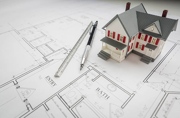 istock Model Home, Engineer Pencil and Ruler Resting On House Plans 522378616