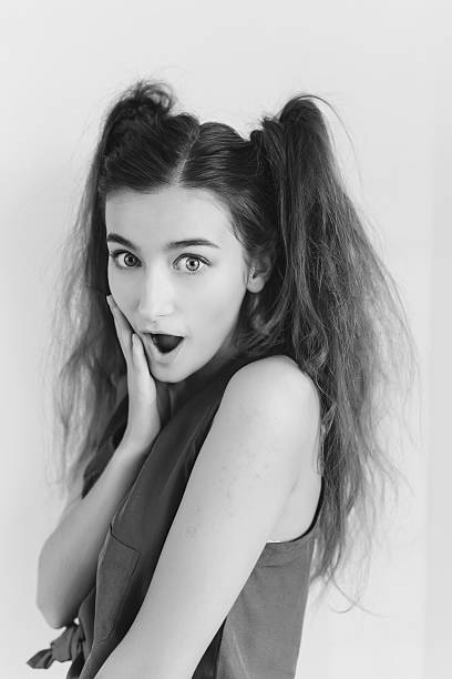istock Surprised young girl with pigtails 522378730