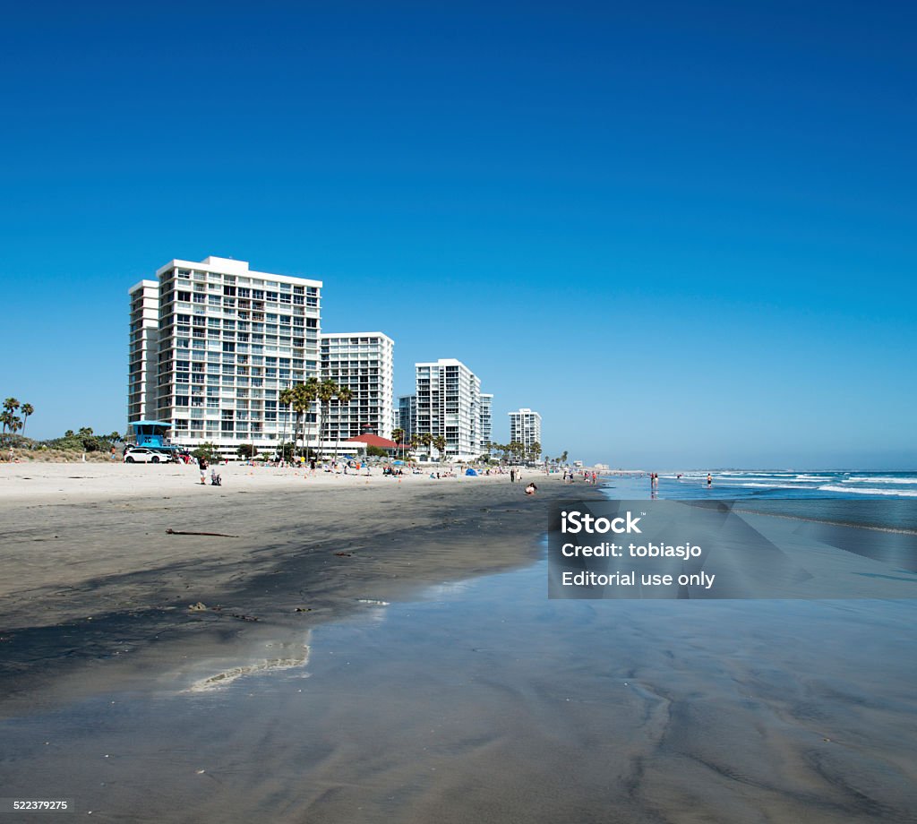 Coronado Beach San Diego Coronado, USA - May 31, 2014: People sunbathing, walking and swimming at the beach on the Coronado Island near San Diego in California, USA. Beach Stock Photo