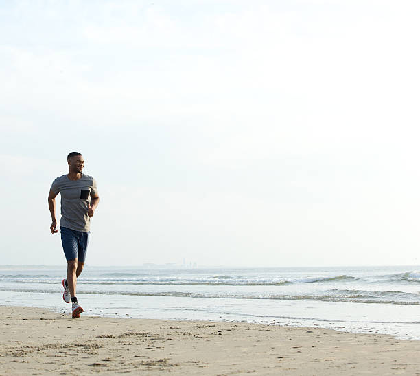 istock Young fit african american man running 522380415