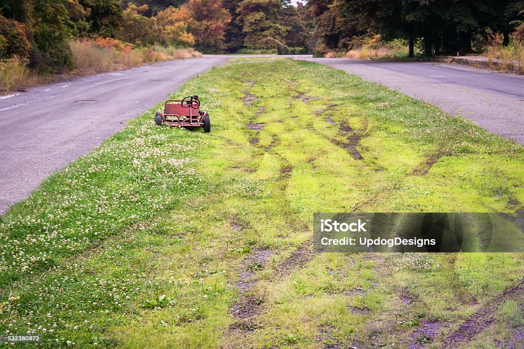 Centralia Abandoned Go Cart A childs toy go-cart sits abandoned on an empty road in Centralia, Pennsylvania, a poignant reminder of the catastrophe that struck the town in 1962. Centralia - Pennsylvania Stock Photo