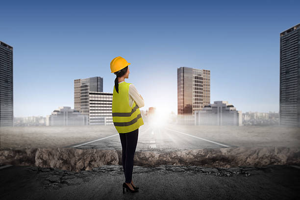 Asian business person in worker suit Asian business person in worker suit looking broken road in the city A panoramic view of a construction site with women in different roles working together. stock pictures, royalty-free photos & images