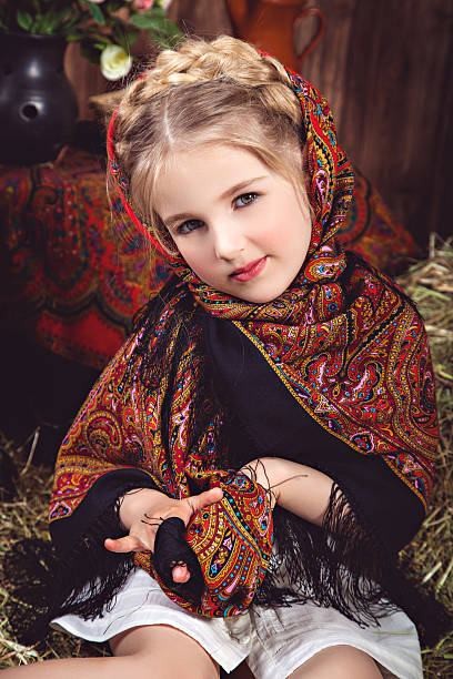 istock Girl with a pigtail in multicolored headscarf 522381376