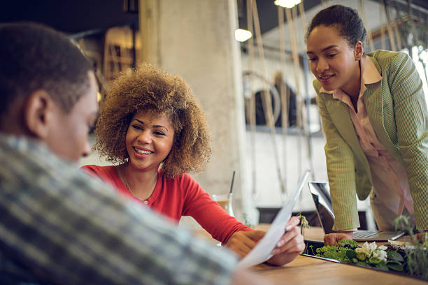 istock African American start up team working on reports at office. 522381560