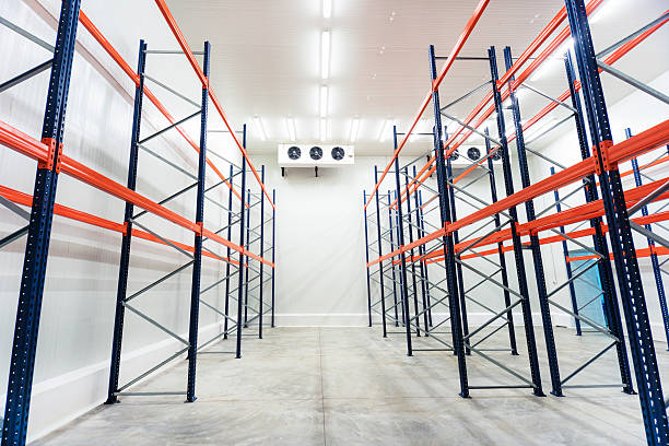 Inside of Big Industrial Refrigerator Storage at -30 Celcius Stacked meat and burger packs are at -30 degrees celcius in a meat processing factory. Big Industrial refrigerator or dryer for any kind of food, meat, fruit or vegetable. From -10 to -80 degrees celcius. refrigeration business air conditioner factory stock pictures, royalty-free photos & images