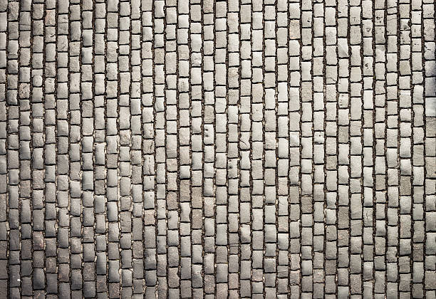 Cobbles from directly above Detail of a street of weathered cobbles in Edinburgh, shot from directly above. cobblestone stock pictures, royalty-free photos & images