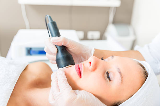 Cavitation treatment Cavitation treatment on the preaty womans face medical laser photos stock pictures, royalty-free photos & images