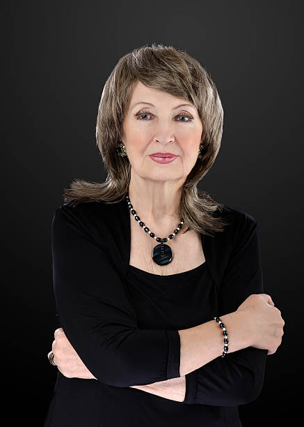 istock Old woman wears blue tiger eye beads set 522382614