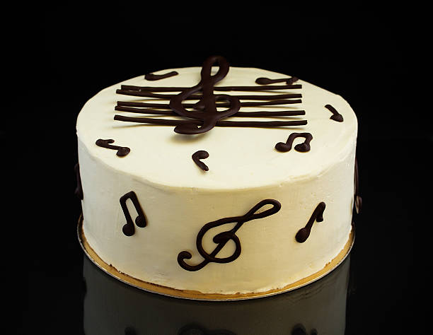 istock Homemade honey cake with orange cream on a white plate. 522382786