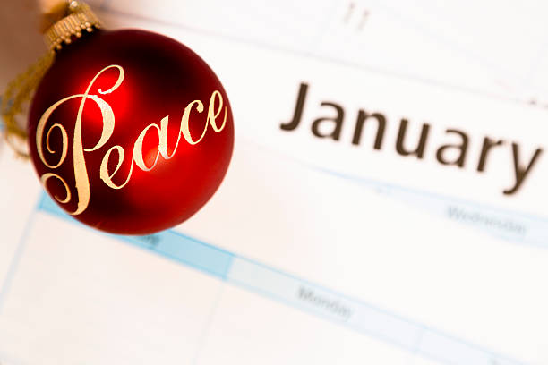 istock Holidays:  January calendar with 'Peace' ornament. Symbol. 522383791