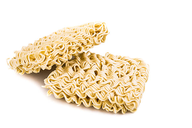 istock Uncooked instant noodles on white background 522383948