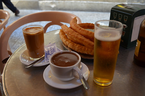typical spanish cafe con leche with churros