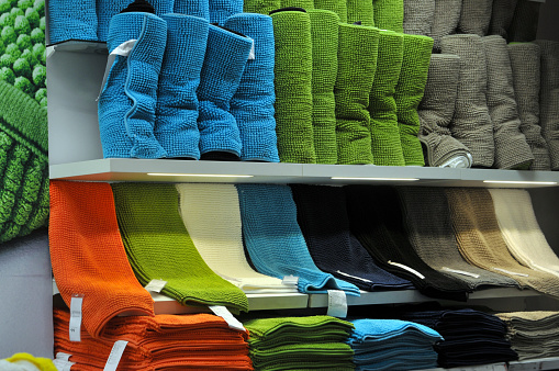 Colorful towels on supermarket