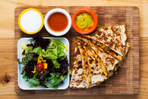 Quesadilla with salsa and sour-cream dipping sauce.Mexican Food for cafe and restaurant