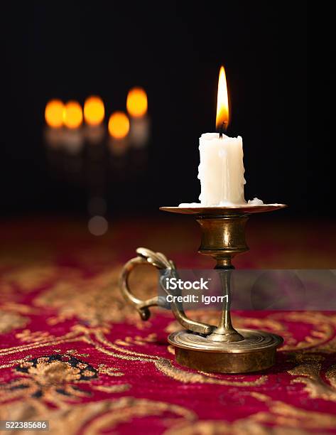 Candle In Small Brass Candlestick Stock Photo - Download Image Now - Black Color, Brass, Bronze - Alloy
