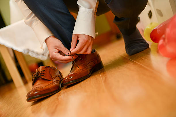 istock Man tied shoelace in natural light 522389670