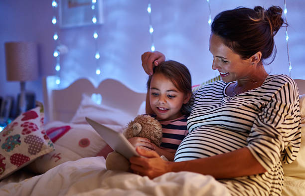istock Choosing her favourite bedtime ebook 522392046
