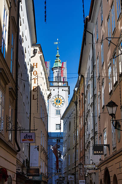 Salzburg, Austria - January 07 2016: View of the tower of Cityhall from the narrow street