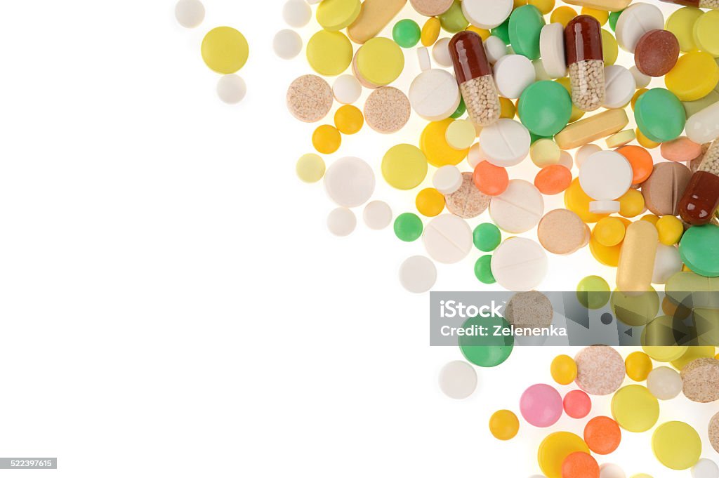 Stack of different pills in blisters isolated on white backgroun Stack of different pills isolated on white backgroundStack of different pills in blisters isolated on white background Addiction Stock Photo