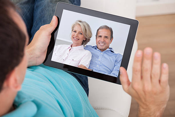 istock Man Having Video Chat With Parents On Digital Tablet 522398133
