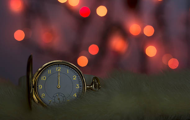 istock Golden watch with red bokeh background 522398337