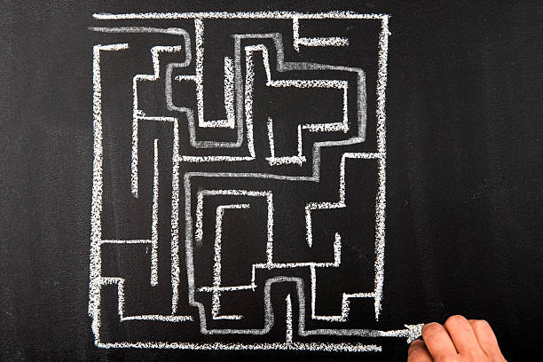istock Drawing the way out through a maze 522398402