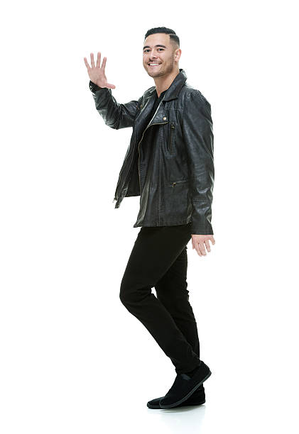 istock Smiling casual man waving hand 522398864