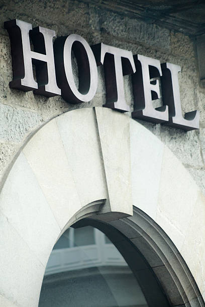 istock Hotel sign on a stone building facade. 522398946