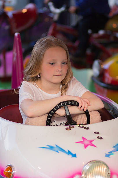 istock Child in amusement park ride 522398990
