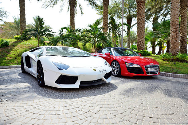 The Atlantis the Palm hotel and luxury sport cars stock photo