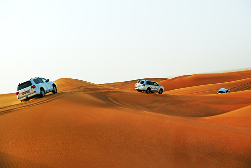 Dubai, UAE - September 12, 2013: The Dubai desert trip in off-road car is major tourists attraction in Dubai.