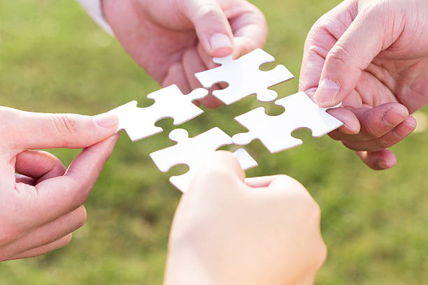 istock puzzle jigsaw and concept with meadow background 522402799