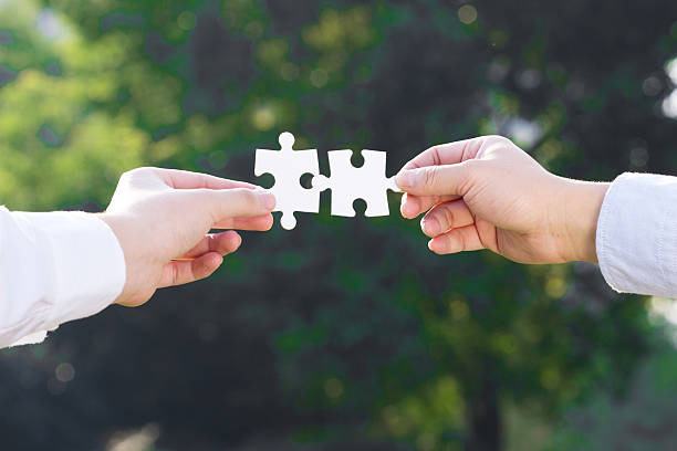 istock puzzle jigsaw and concept with trees background 522402837