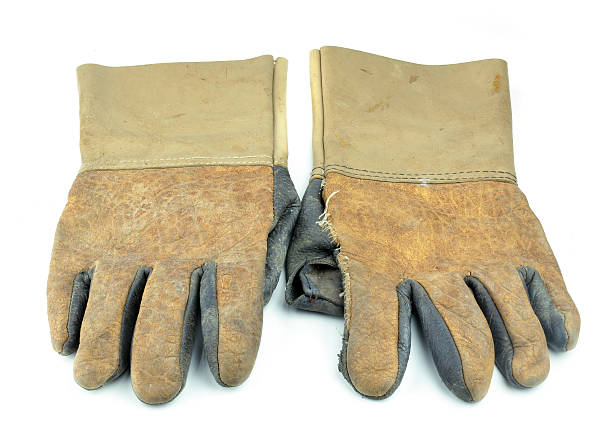 istock Dirty leather glove isolated on white background 522403143